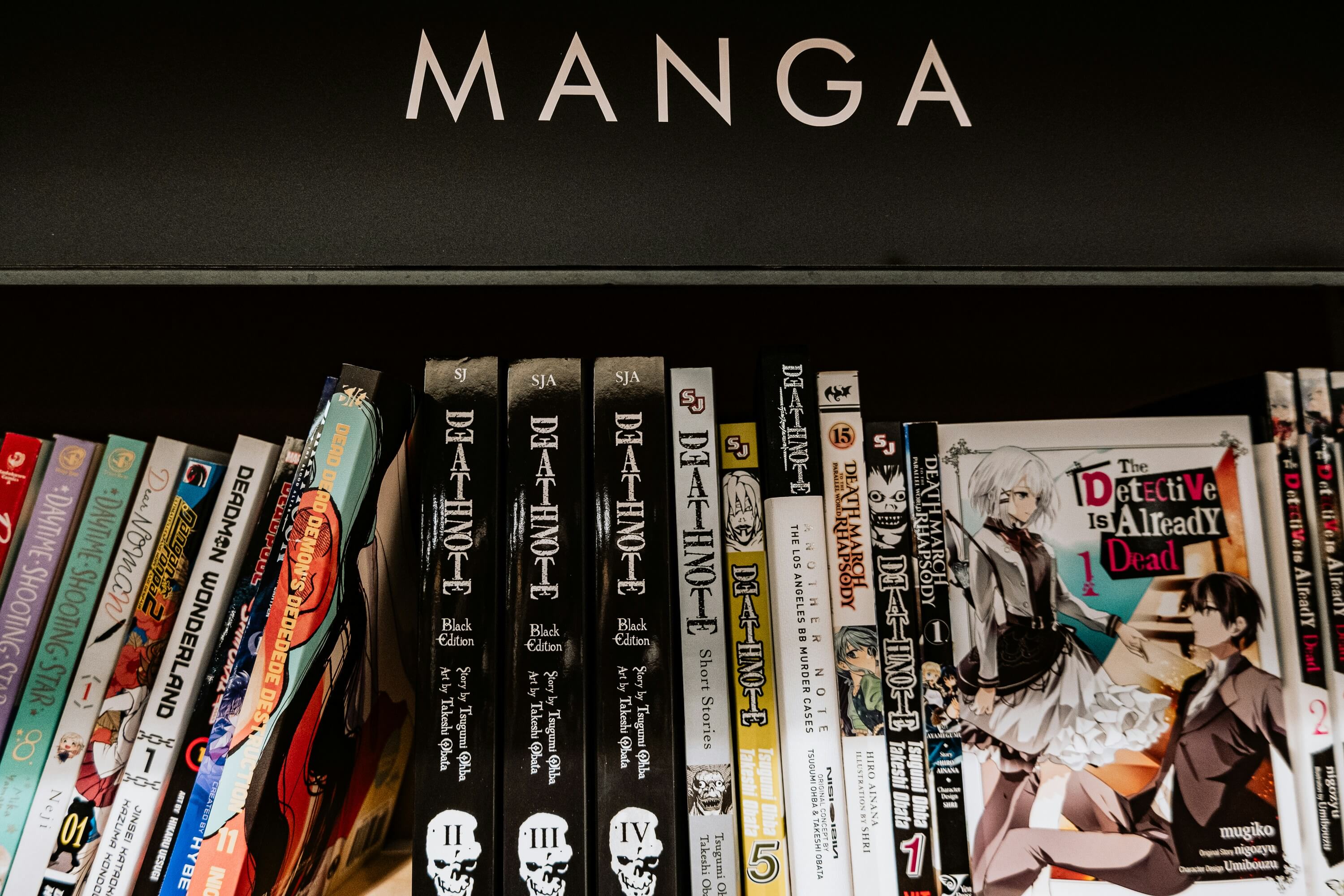 Manga shelf with Death Note books Bookshelf of Japanese manga volumes including Death Note